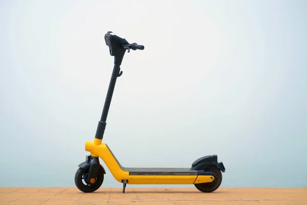 Yellow Electric Scooter Misty Background —  Fotos de Stock