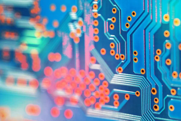 High tech blue electronic circuit board background, selective focus