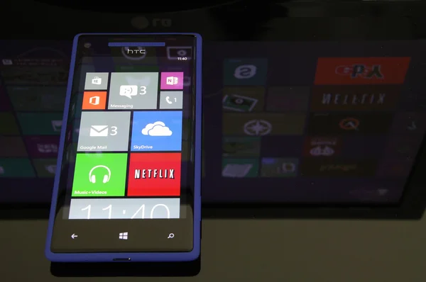 Windows Phone 8 with Windows 8 reflection — Stock Photo, Image