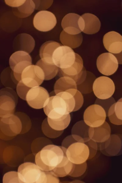 Χρυσά Χριστουγεννιάτικα Φώτα Σκούρο Φόντο Εστιασμένα Φωτισμένο Φόντο Bokeh Λαμπερά — Φωτογραφία Αρχείου