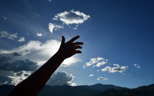 Hands raised to heaven — Stock Photo, Image