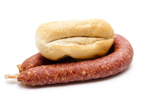 Spicy sausage with bread roll — Stock Photo, Image