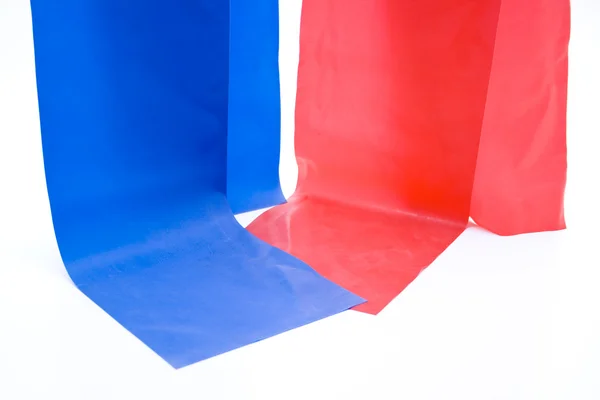 Blauwe en rode elastieken band — Stockfoto