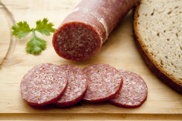 Salami and crust bread — Stock Photo, Image