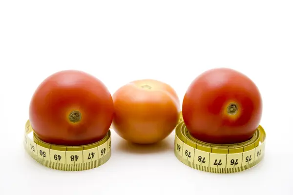 Tomato with measuring tape — Stock Photo, Image