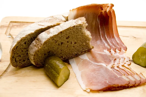 Ham bacon with cucumber — Stock Photo, Image