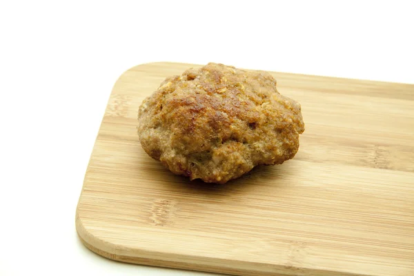 Meatball on wooden plate — Stock Photo, Image