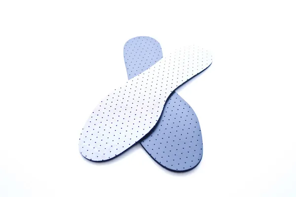 Orthopädische Schuheinsätze in blau und weiß — Stockfoto