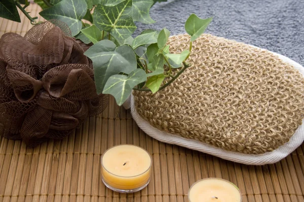 Massage sponge with candle — Stock Photo, Image