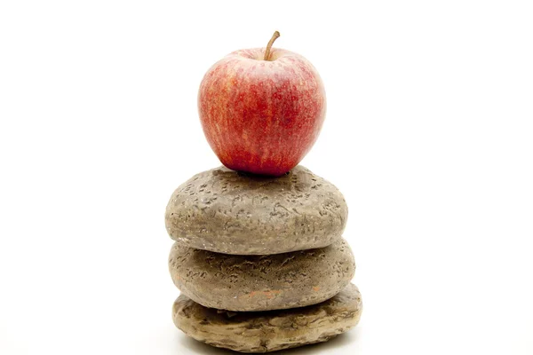 Apple and stones — Stock Photo, Image