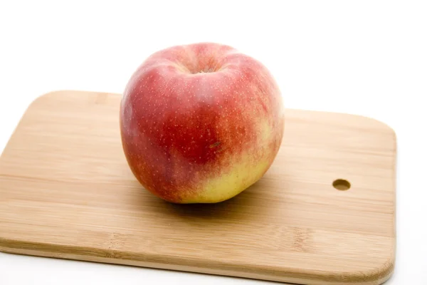 Fresh red Apple on wooden plate — Stock Photo, Image