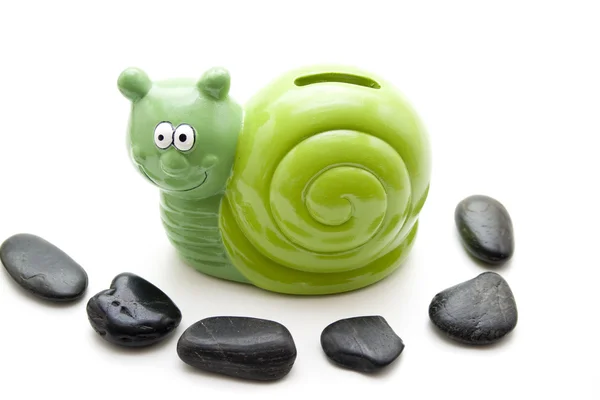 Ceramic savings tin with stones — Stock Photo, Image