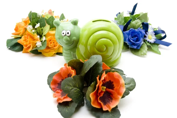 Snail par tin with flowers — Stock Photo, Image