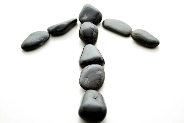 Black stones as an arrow — Stock Photo, Image