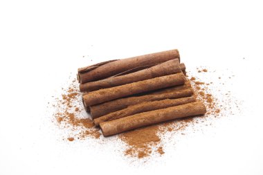 Cinnamon sticks with cinnamon powder clipart