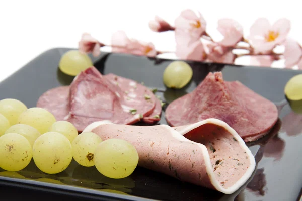 Liver sausage with wine grapes — Stock Photo, Image