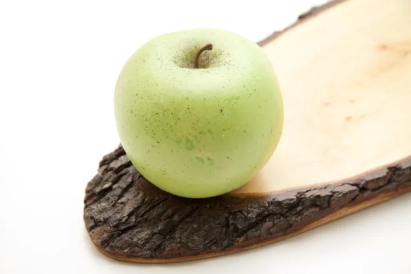 Apple on wooden board — Stock Photo, Image