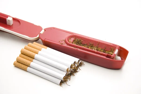 Cigarrillos con aparato de zurcido —  Fotos de Stock