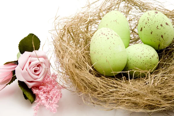 Easter eggs in the hay nest — Stock Photo, Image