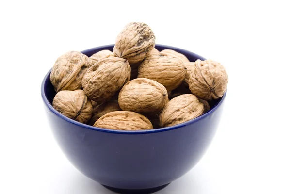 Walnuts in porcelain bowl — Stock Photo, Image