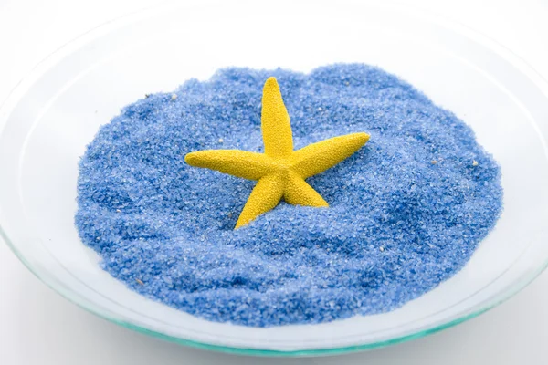 Pequeñas piedras azules con estrella de mar —  Fotos de Stock