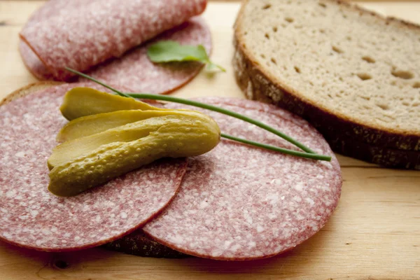 Salami with bread and cucumber — Stock Photo, Image