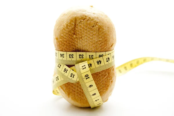 Wheat bread rolls with dimension tape — Stock Photo, Image