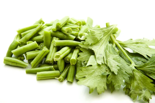 Green beans with celery leaves — Stock Photo, Image