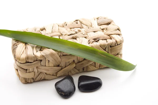 Stones with leaf and basket — Stock Photo, Image