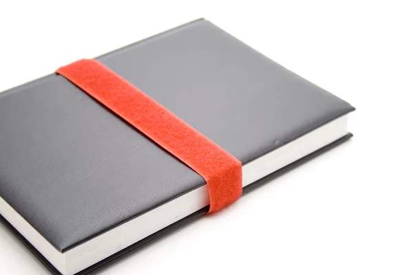 Notebook with red felt tape — Stock Photo, Image