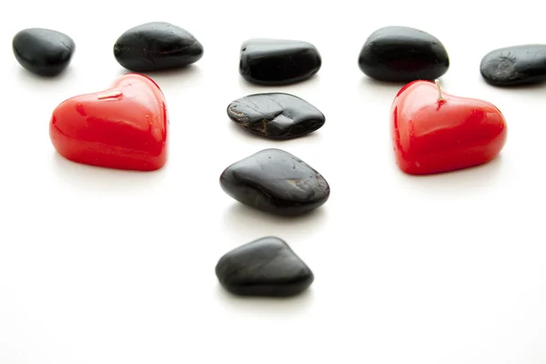 Piedras negras con vela de corazón —  Fotos de Stock