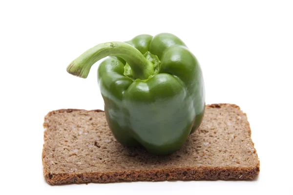 Paprika pod with wholemeal bread — Stock Photo, Image