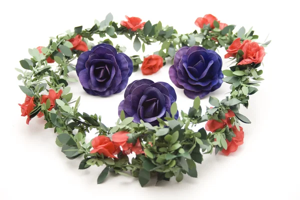 Rose blossoms with garland — Stock Photo, Image