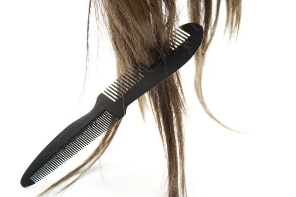 Волосы с расчёской — стоковое фото