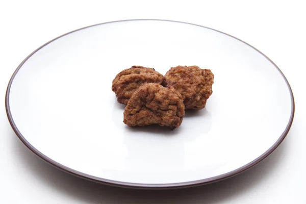 Rissoles on porcelain plate — Stock Photo, Image