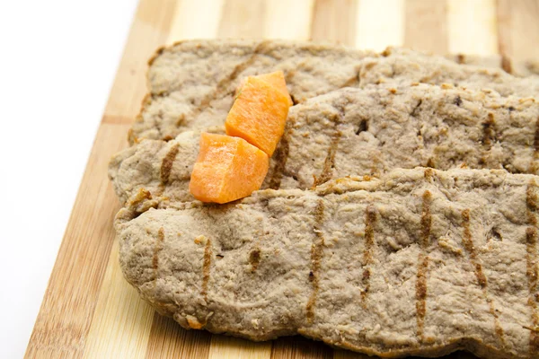 Grill steaks with carrot — Stock Photo, Image