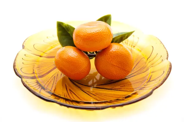 Tangerines on glass plate — Stock Photo, Image