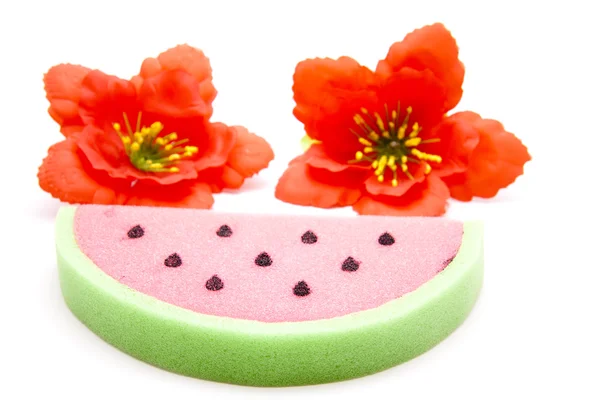 Melon sponge with hibiscus blossom — Stock Photo, Image