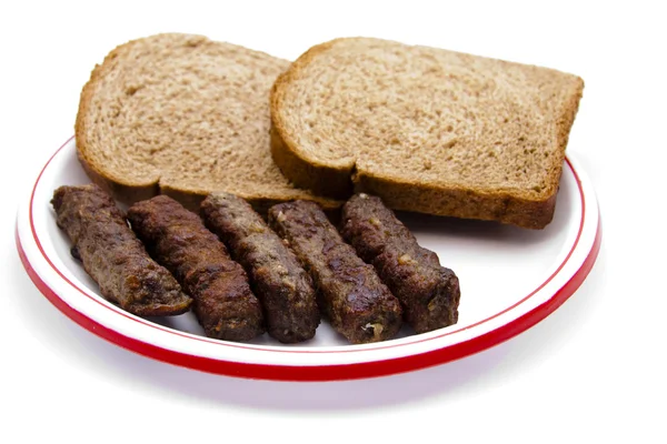 Little minced meat roles with toast — Stock Photo, Image