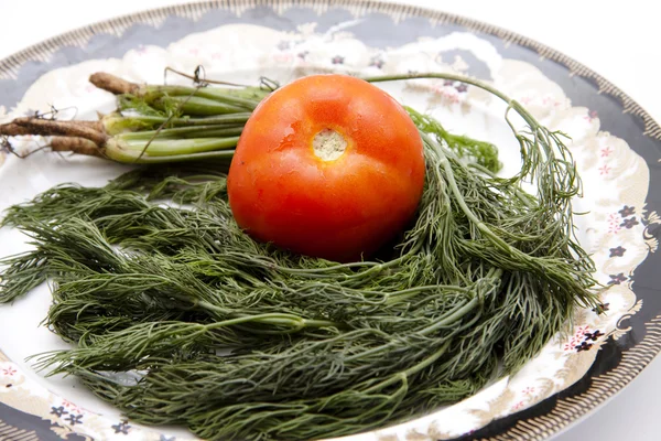 Tomato with dill — Stock Photo, Image