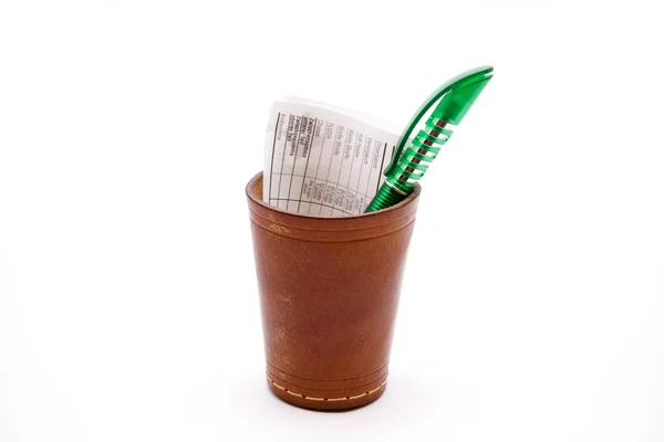 Dice cup with ballpoint pen — Stock Photo, Image