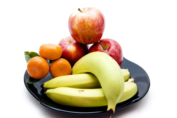 Bananas with apples and oranges on plate — Stock Photo, Image