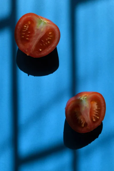 Tomatoes Blue Background Shadows — стоковое фото
