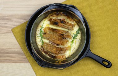 Baked toast sandwiches with mortadella and cheese sauce