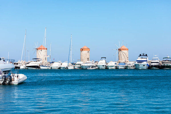 Windmills in the Mandraki port of Rhodes, Greece