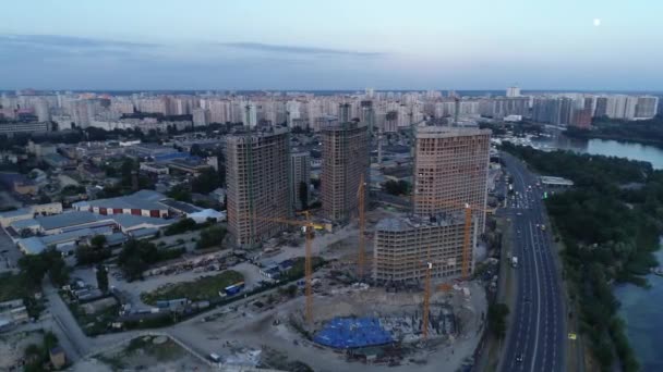 Aerial view of the construction of a new modern residential complex near the river, Kyiv, Ukraine — стокове відео
