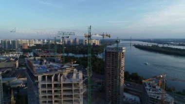 Aerial view of the construction of a new modern residential complex near the Dnieper River, Kyiv, Ukraine. 4k video footage