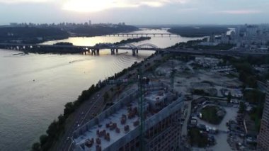 Aerial view of the construction of a new modern residential complex near the Dnieper River, Kyiv, Ukraine. 4k video footage