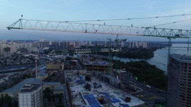 Aerial view of the construction of a new modern residential complex near the Dnieper River, Kyiv, Ukraine. 4k video footage