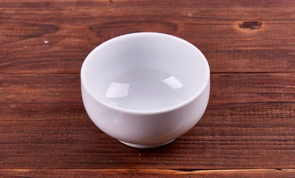empty bowl over wooden background